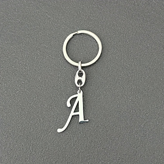 1pc Fashionable Stainless Steel 26-Letter Keychain - The Perfect Choice for Men's Backpacks and Car Accessories, Minimalist Pendant