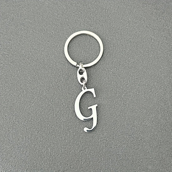 1pc Fashionable Stainless Steel 26-Letter Keychain - The Perfect Choice for Men's Backpacks and Car Accessories, Minimalist Pendant